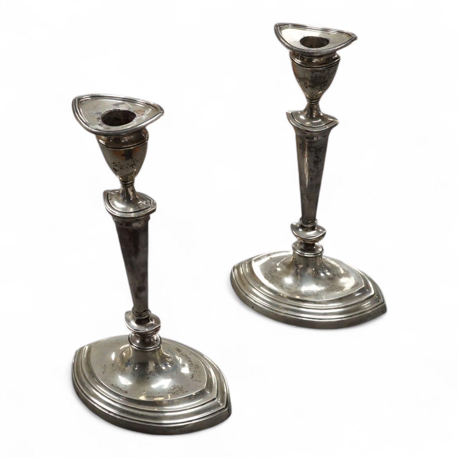 A pair of George V silver oval candlesticks, by Walter Latham & Son, Sheffield, 1919, height 24cm, weighted. Condition - fair